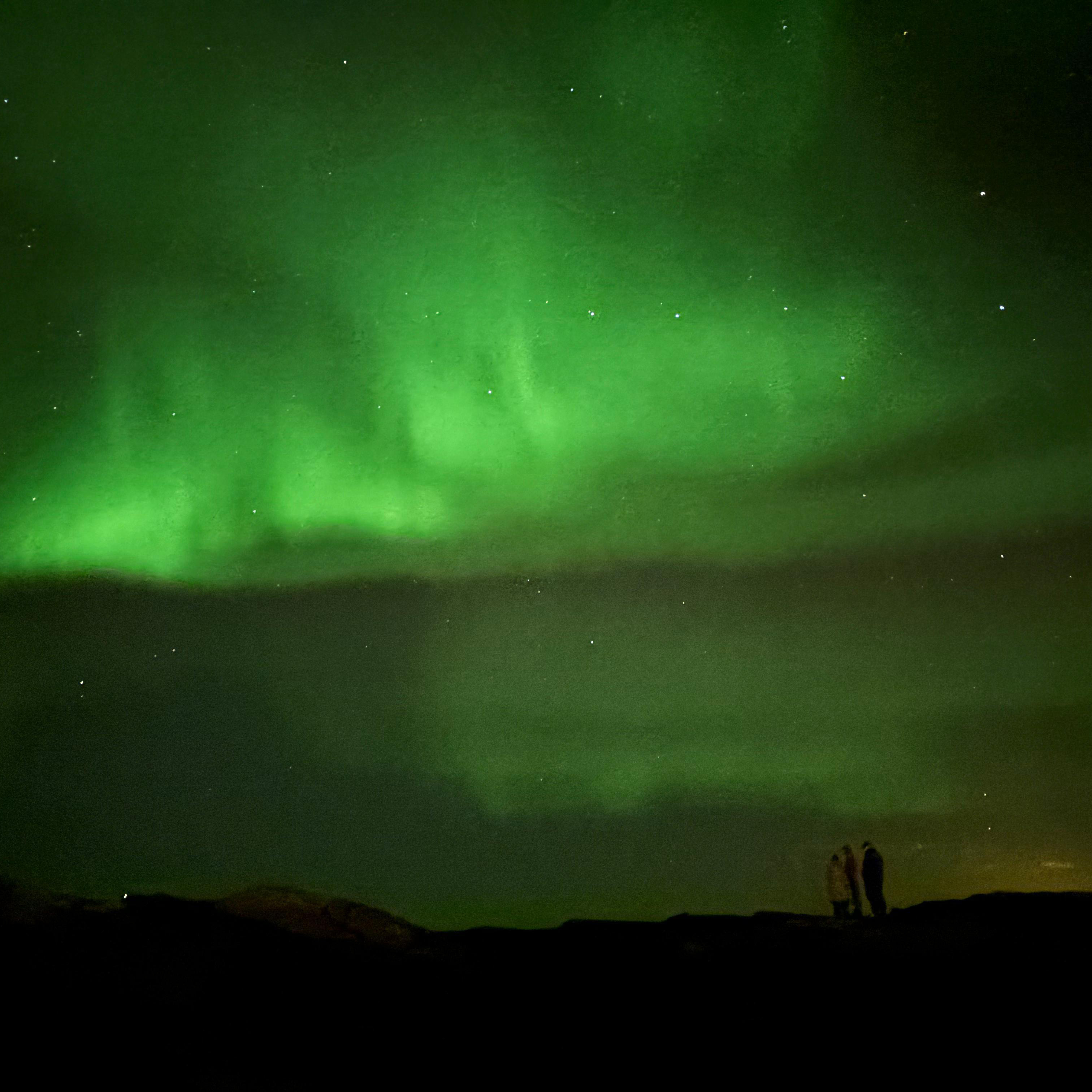 Northern Lights turn the dark sky green over Iceland