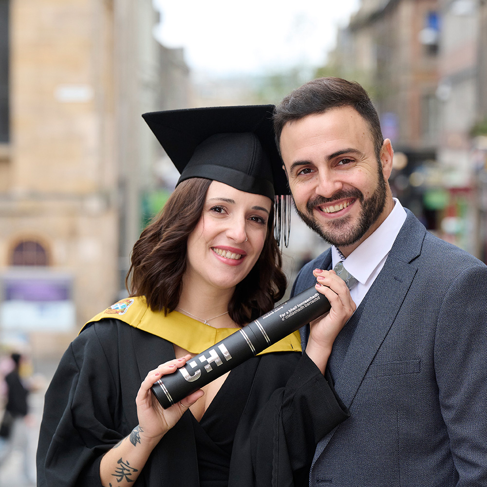 Rocio Suarez Rubiales and Javier Monoz Moreno with a scroll