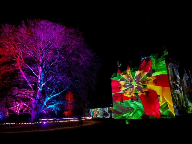 A photograph taken by E's Eyes showing Brodie Castle illuminated by custom animated projections