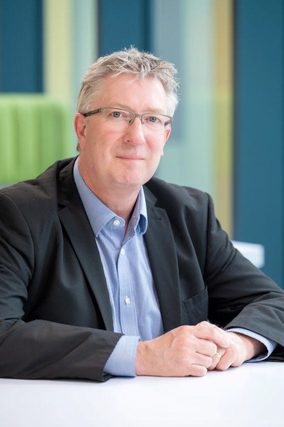 Mike Baxter sitting at a table