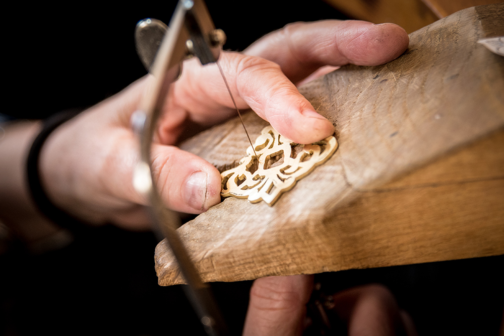 Hands making jewellery