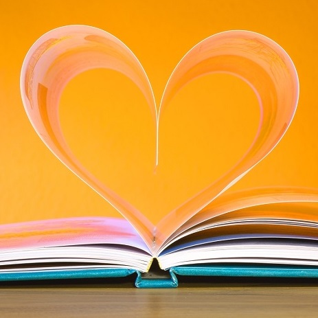 An open book with pages in the shape of a heart