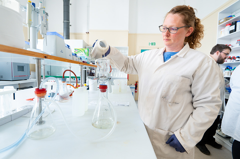 Researcher in a lab using equipment