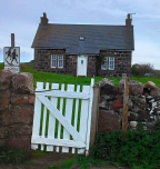 Cottage with white garden gate