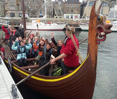 Summer course participants sailing on a replica Viking ship in Shetland