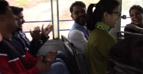 Students laughing on a bus