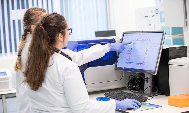 Researcher and research student in the lab