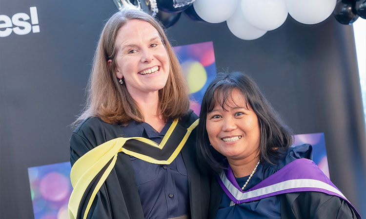 Two UHI graduates at their graduation ceremony