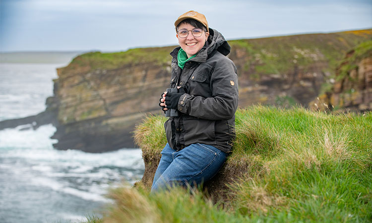 Student researcher from the Environmental Research Institute carrying out field studies at the rugged coast in Thurso