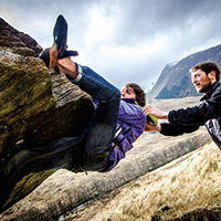 Two people rock climbing